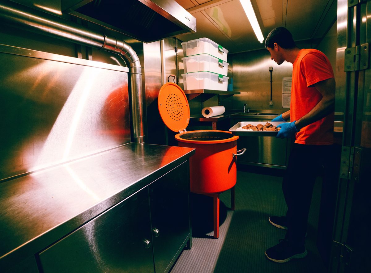 Inside the truck: stainless benches, drum cooker and sink